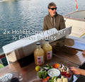 2x ½ Gallon glass bottles of HoliDrink Holi EH Spicy Ginger
